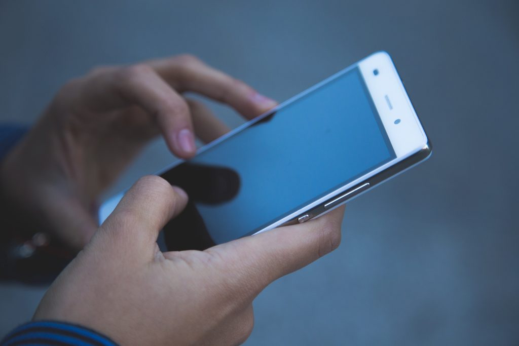 Image of person using their phone